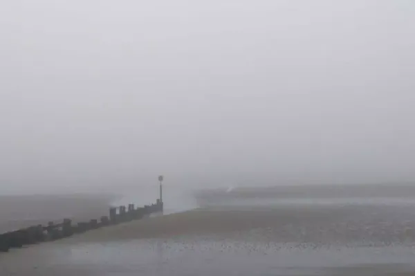 Mysterious White Figure Spotted on Beach in Heavy Fog: Is It a Ghost?
